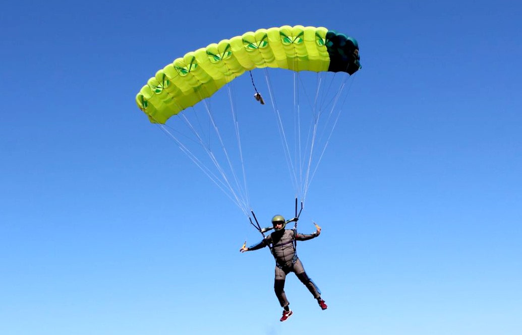 Commando Skydivers green parachute