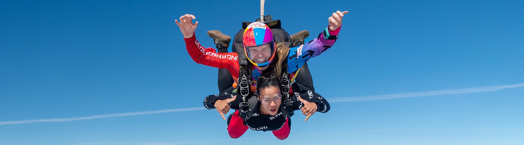 A Skydive Downunder tandem master skydiving with their very happy first time skydiver