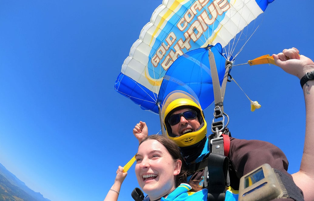 A skydiving tandem master and passenger, under canopy in the Gold Coast, Queensland.