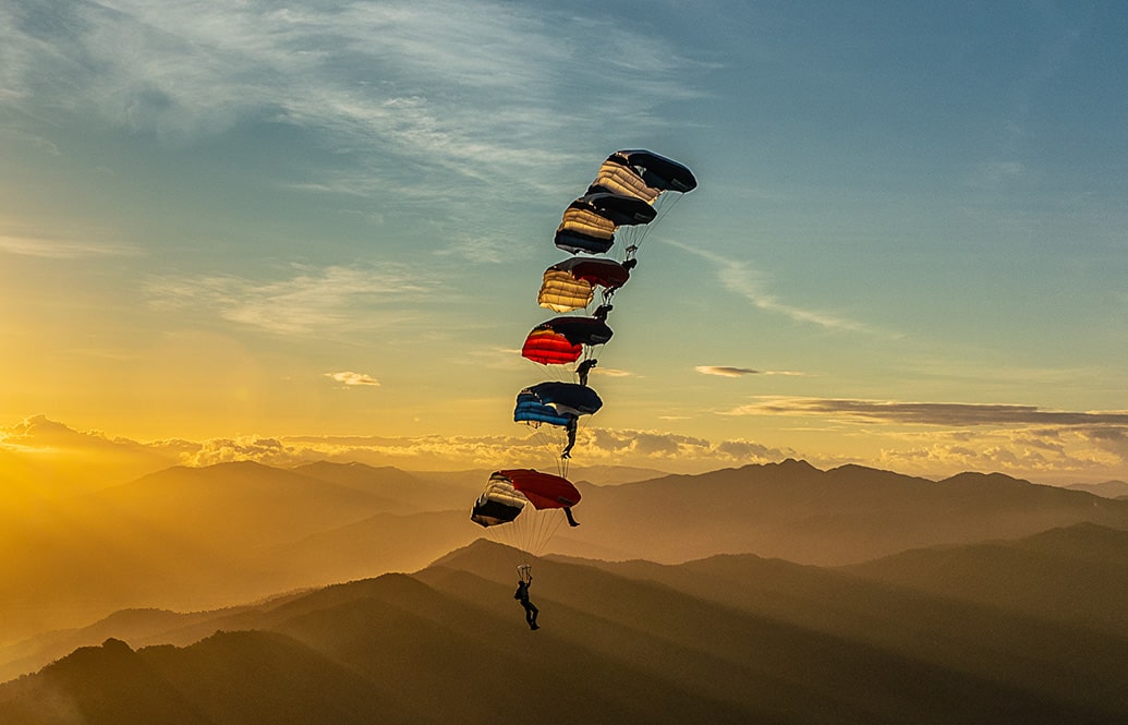 A stacked formation of skydivers.