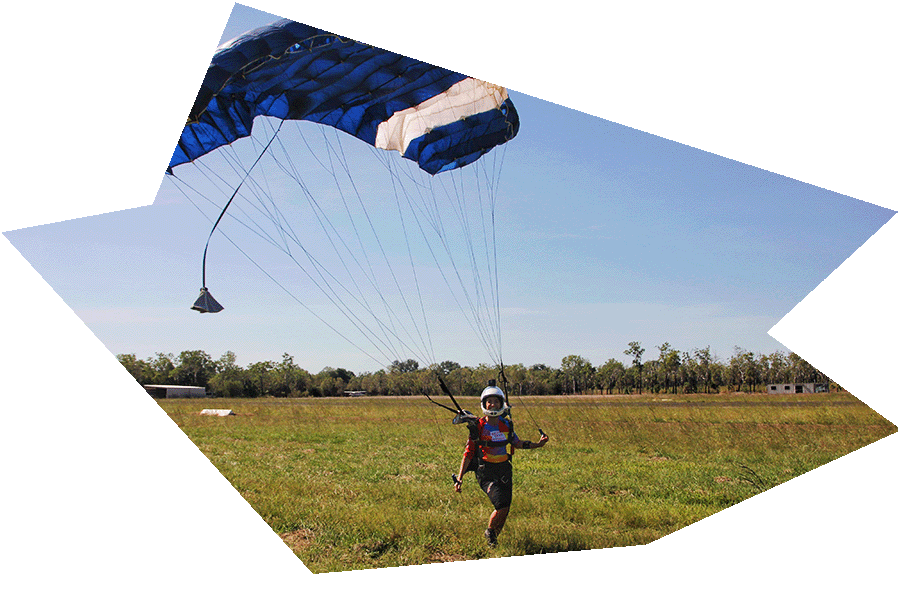 Smiling team member Sasha after a landing in a grassy field.