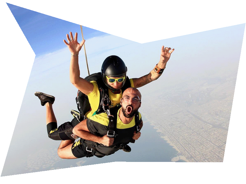 Vova Atamas with a tandem passenger skydiving in Dubai.