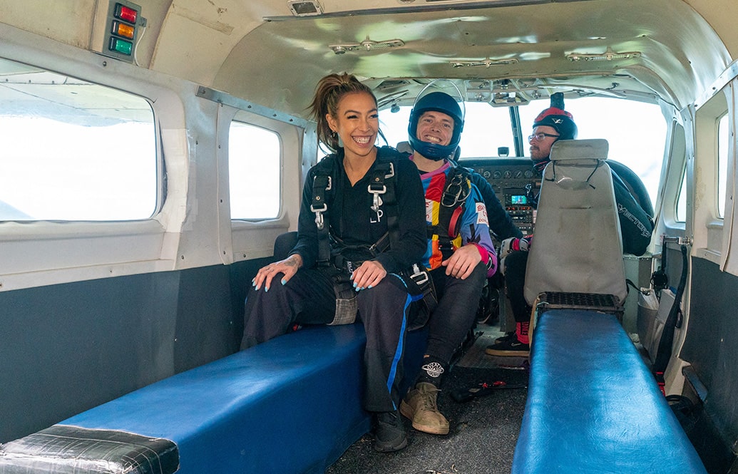 Tandem master and student in plane waiting to jump