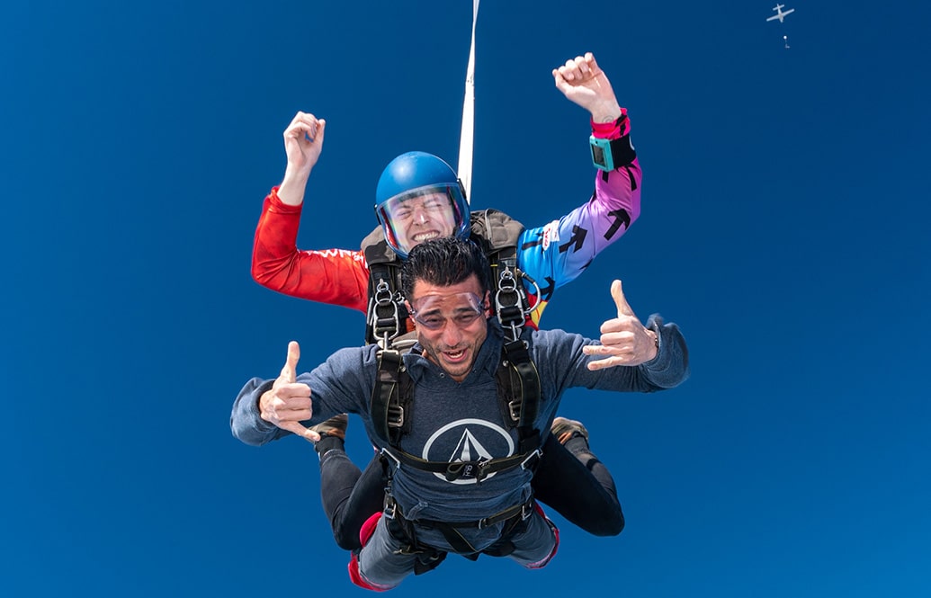 Tandem master and student in freefall.